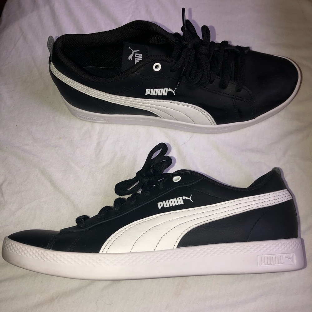 Black and white leather classic pumas